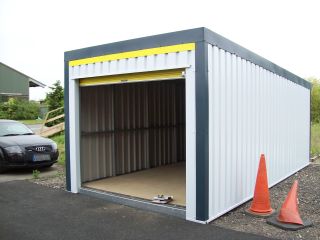 Simple box-style garage in white steel cladding