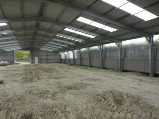 Interior of a new farm shed with plastiglass walls